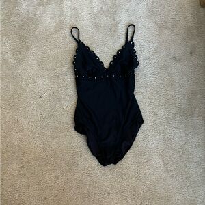Grungy black one piece swimsuit with metal detailing